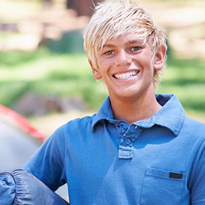 Boy smiling in a blue shirt