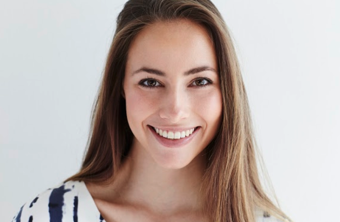 Woman Smiling After Cosmetic Dental Treatment